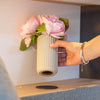 Magnetic soap dispenser and magnetic toothbrush cup including pads