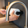 Magnetic kitchen roll holder including metal bar