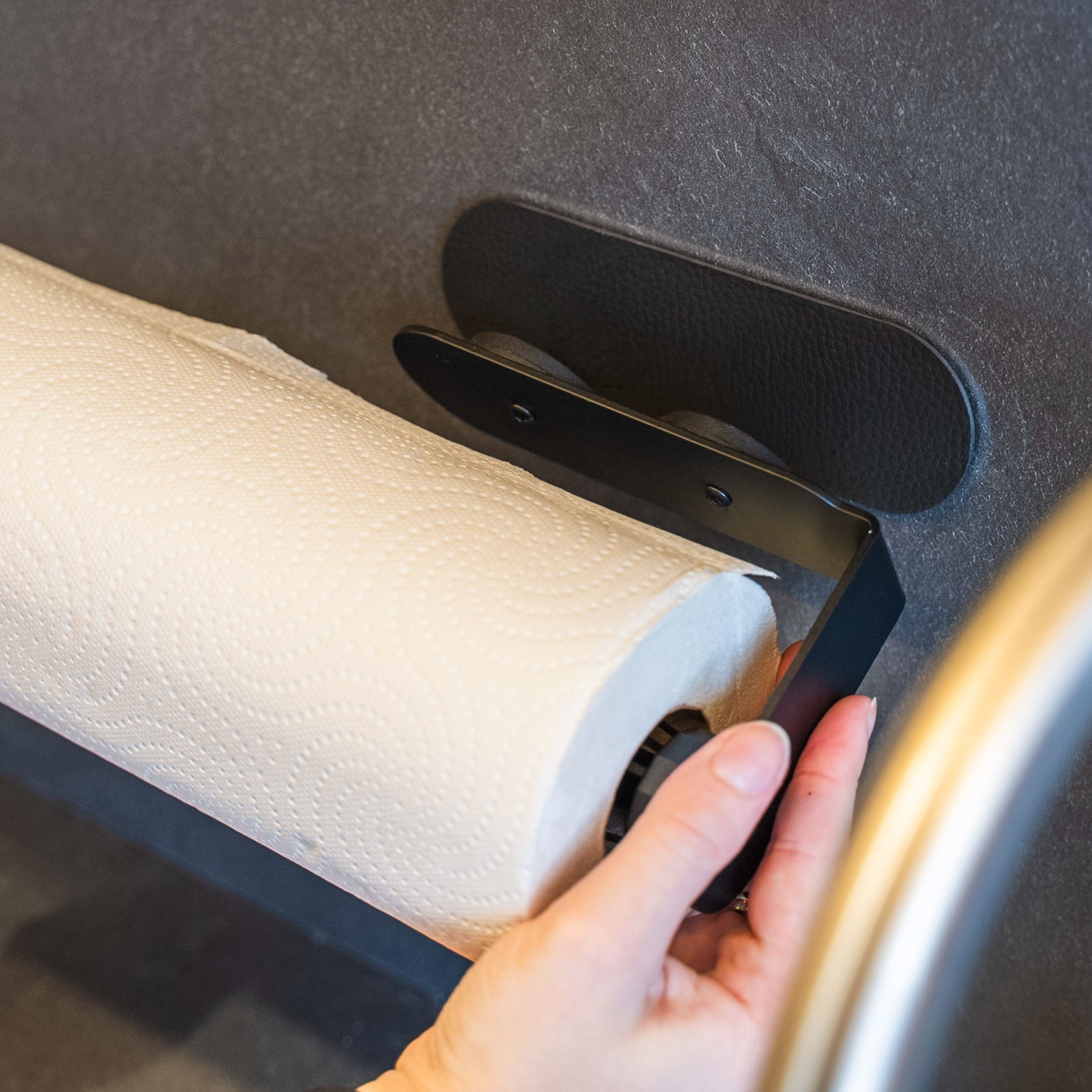 Magnetic kitchen roll holder including metal bar