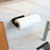Magnetic kitchen roll holder including metal bar