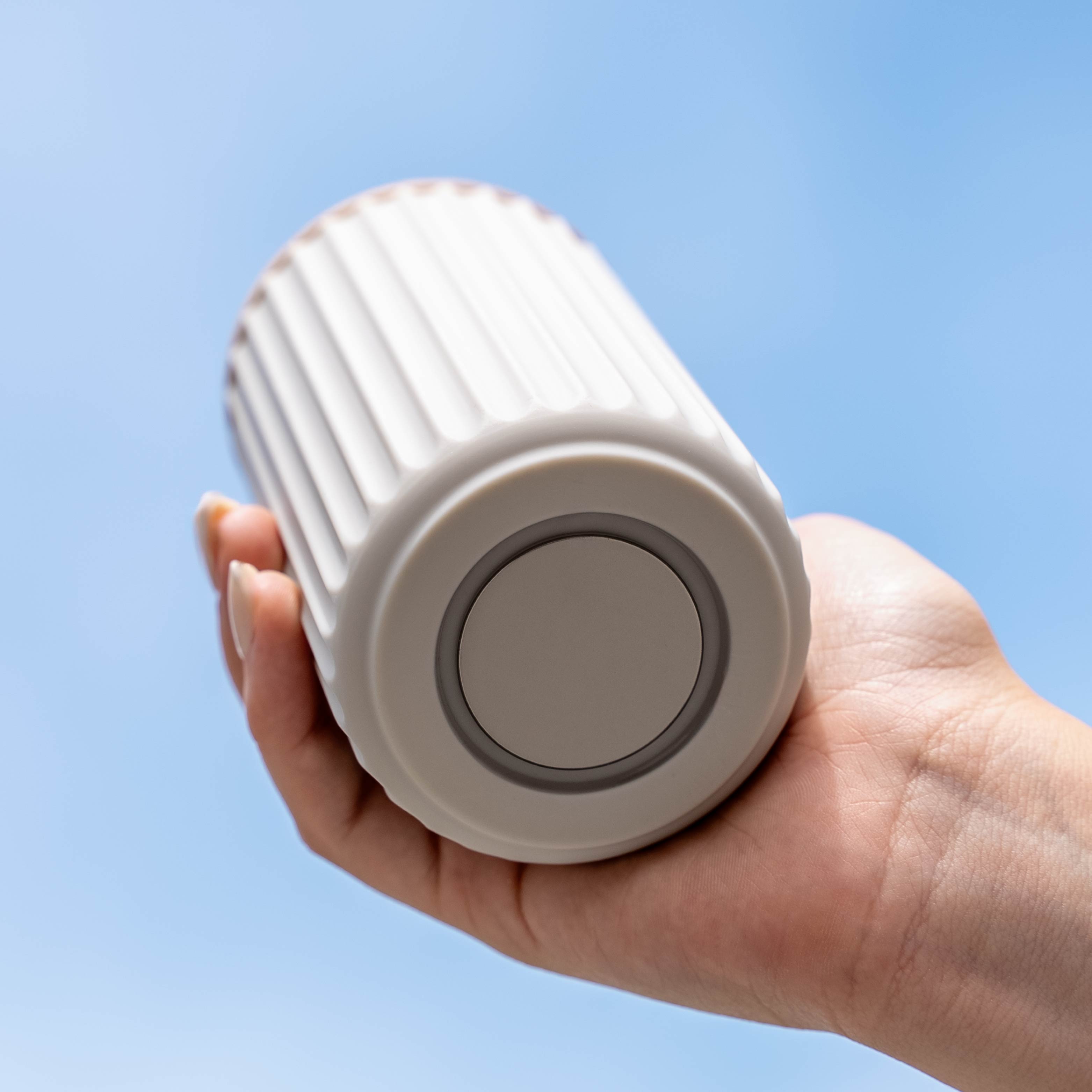 Magnetic soap dispenser and magnetic toothbrush cup including pads